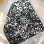 a bag of 0.25 inch chopped carbon fiber flakes